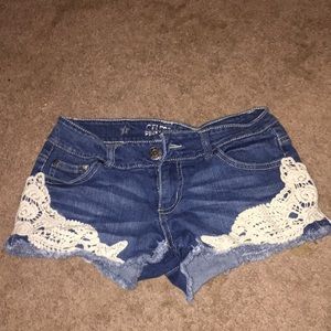 Blue jean shorts with design on bottom